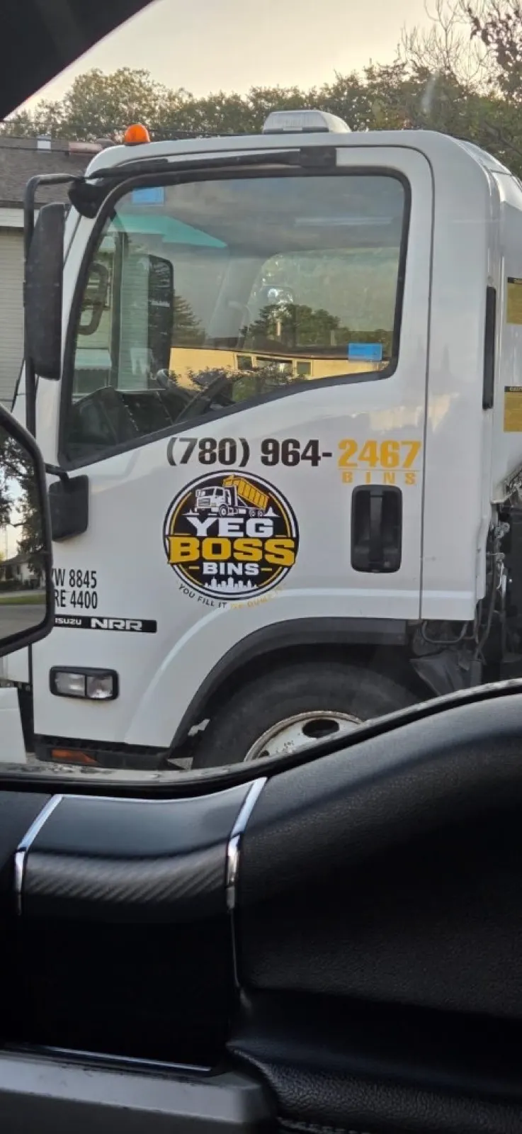 YEG Boss Bins truck cab at a residential drop