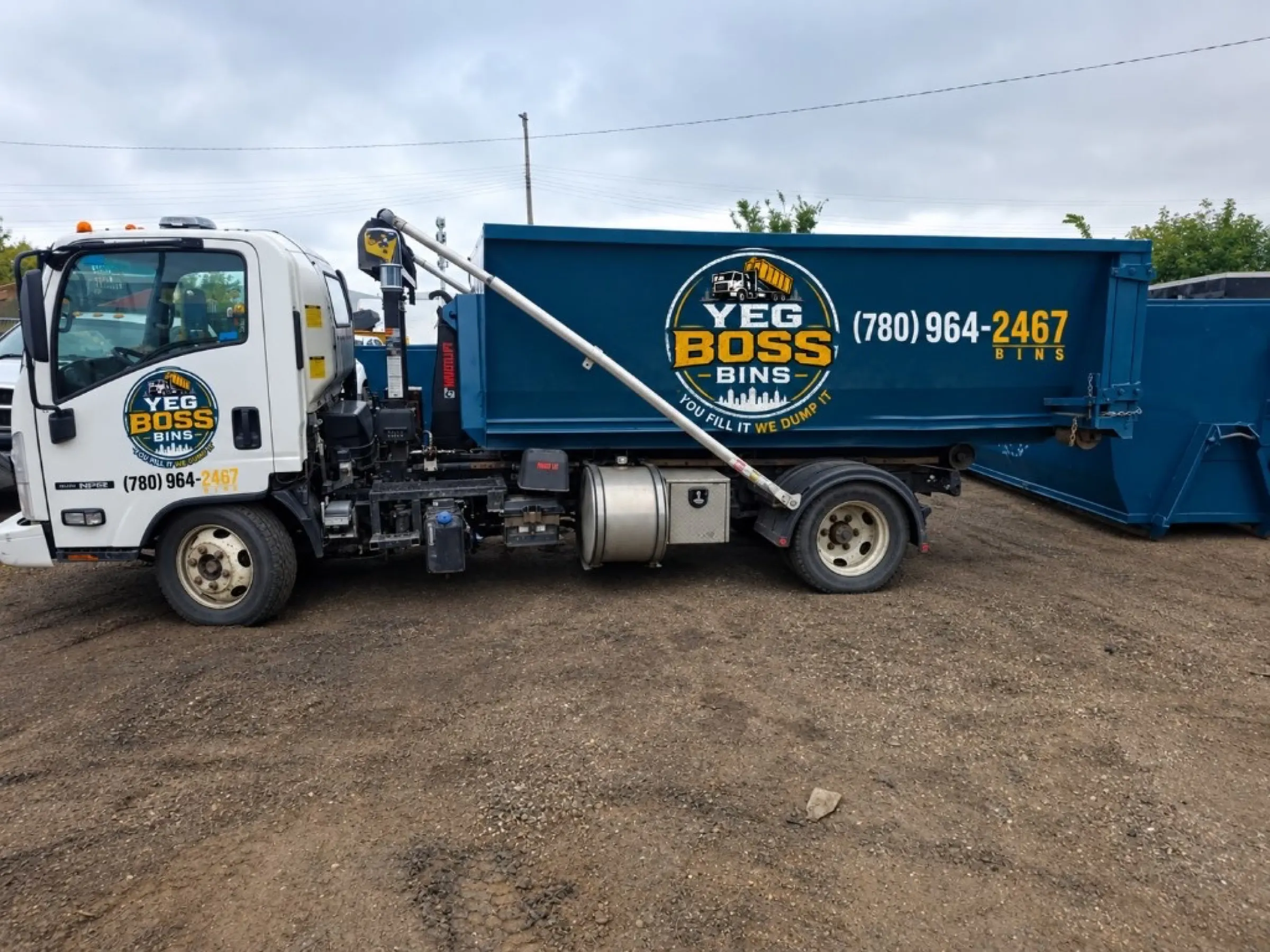 YEG Boss Bins truck delivering a roll-off bin in Edmonton
